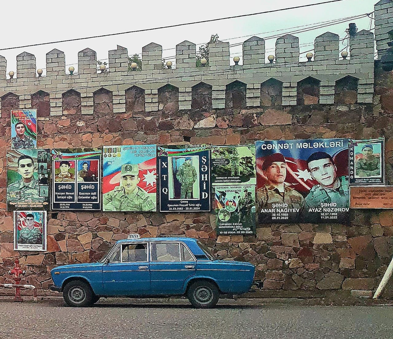 Memorial mural displaying photographs of fallen Azerbaijani soldiers, honoring those who gave their lives in service to their country